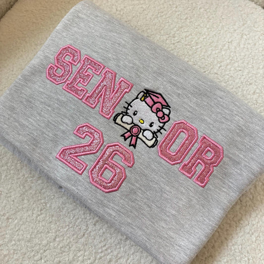 Class of 2026 Senior Sweatshirt – Pink Glitter Hello Kitty Graduation Crewneck-Senior 2026 sweatshirt-Hello Kitty graduation sweatshirt